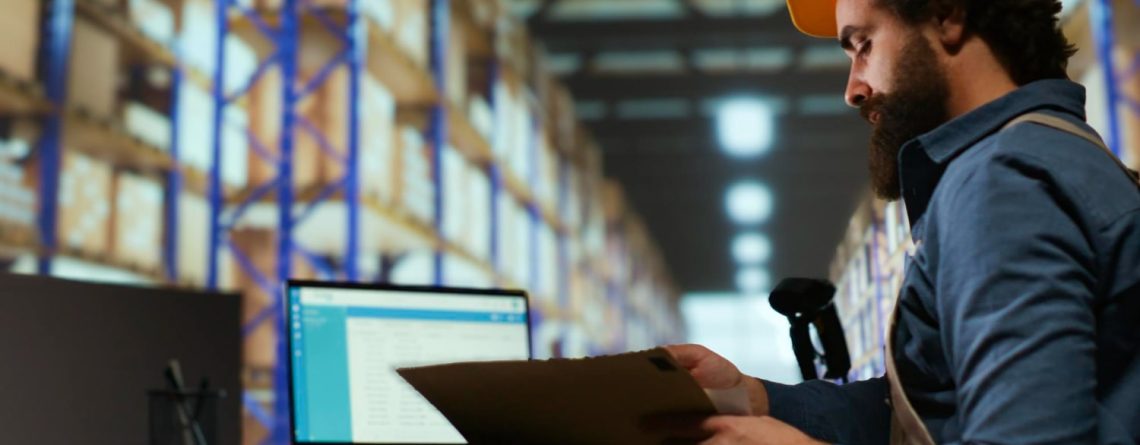 A beard man is looking at automation in retail warehouse